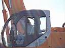 19.jpg: Skilled backhoe operator at work